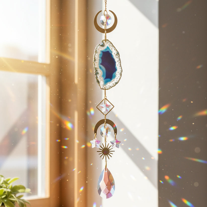Decorative hanging crystal with colorful gemstones on a white background