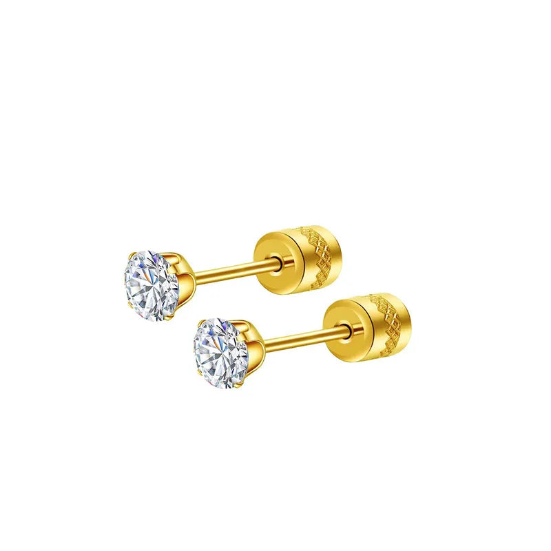 Pair of gold stud earrings with clear gemstones on a white background
