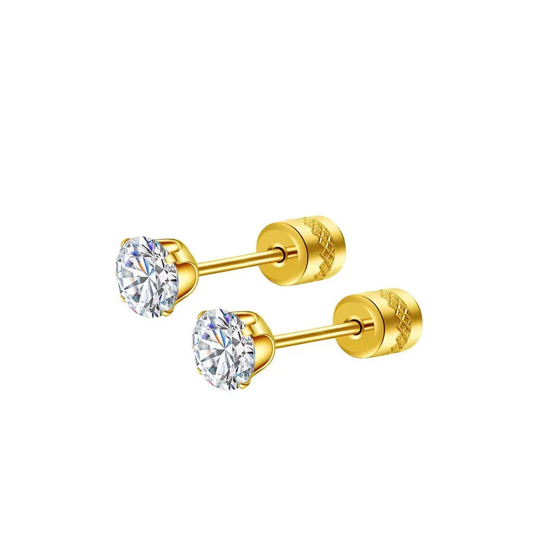 Gold earrings with clear gemstones on a white background