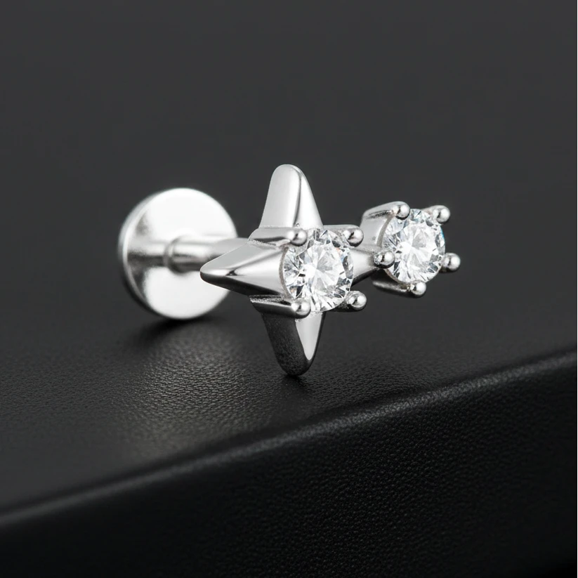 Silver earring with clear gemstones on a white background, featuring a 925 sterling silver stamp.