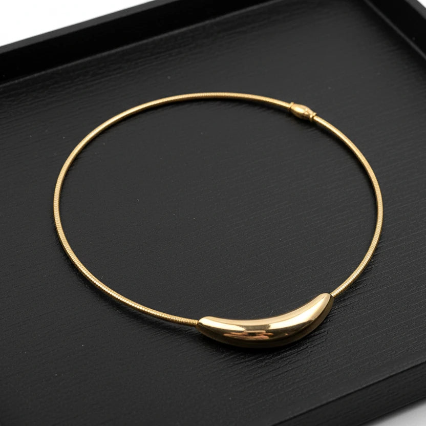 Gold necklace on a white background