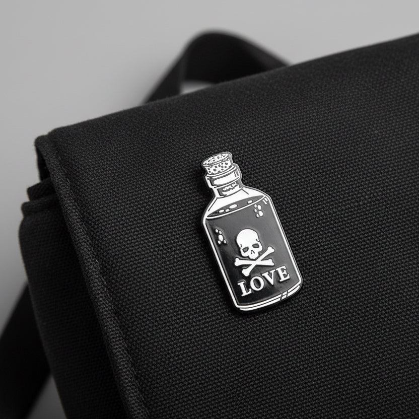 Black bottle with skull and crossbones label on a white background