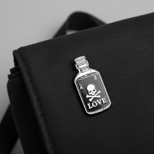 Black bottle with skull and crossbones label on a white background