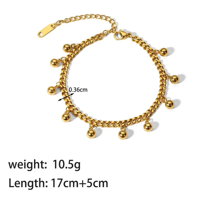Gold bracelet with chain and spherical ends on a white background, showing weight and length measurements.