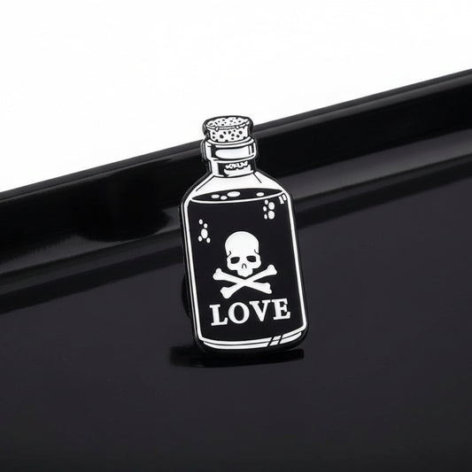Bottle labeled 'LOVE' with a skull and crossbones on a white background